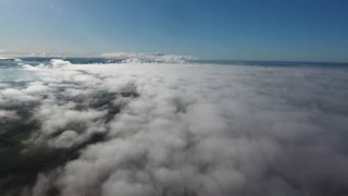 videoblocks-drone-shot-flying-over-clouds-high-altitude-in-south-of-france-mediterranean-sea-in-background_Buev1J-fs7